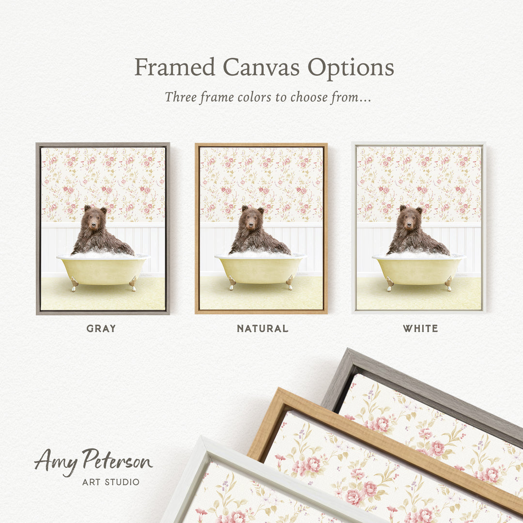 The image is a framed canvas option showcasing three different framed canvas options for a painting of a bear sitting in a bathtub.