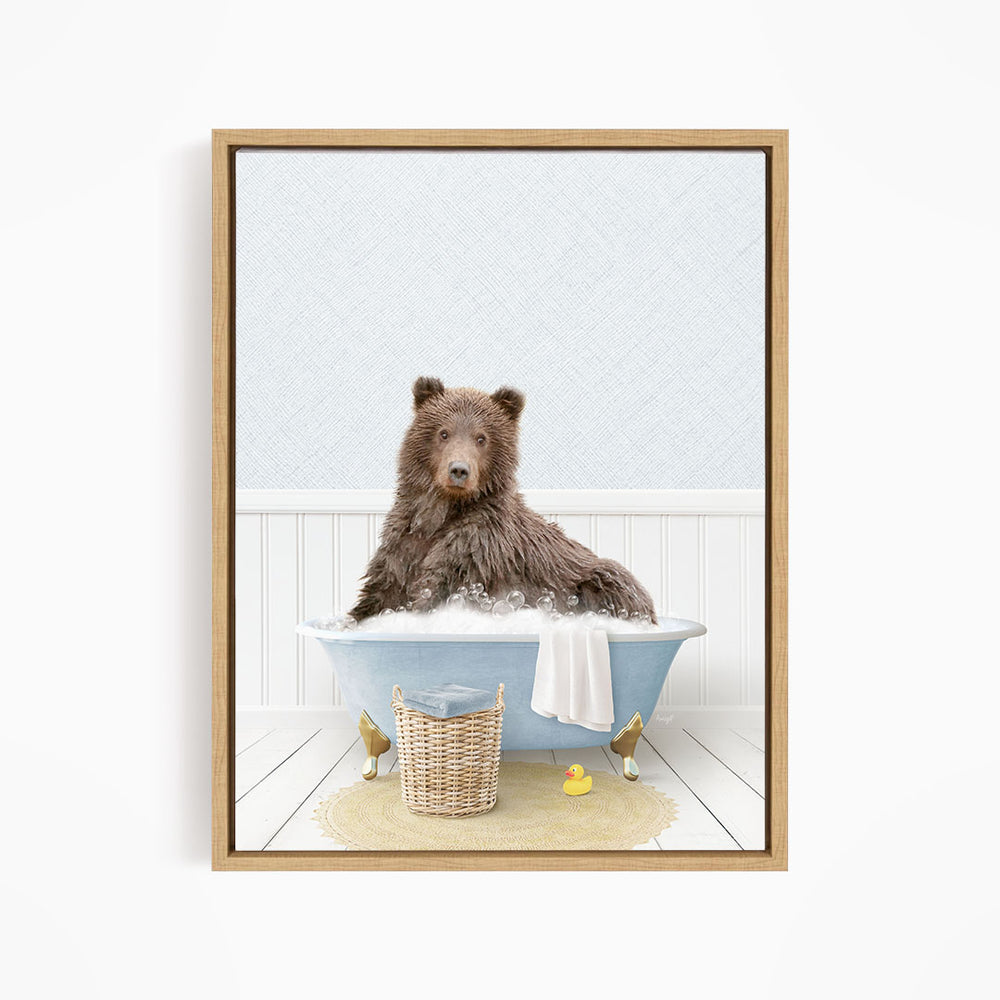 A brown bear sitting in a blue bathtub filled with water, surrounded by rubber ducks.