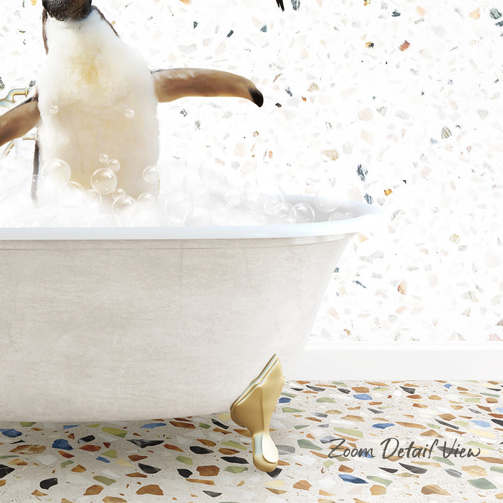 A penguin standing in a bathtub filled with bubbles, with a mosaic floor in the background.
