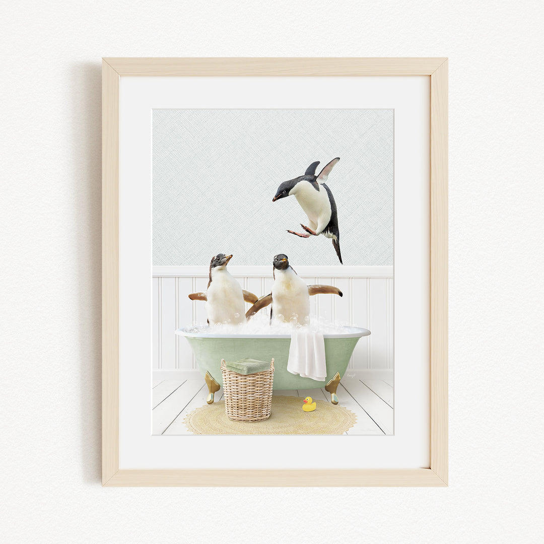 A framed image depicting two penguins sitting in a bathtub, with one penguin flying towards the other penguin.