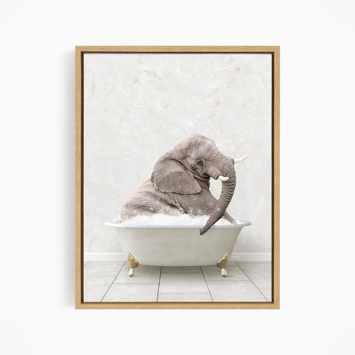 A gray elephant is sitting in a white bathtub, with its trunk raised and appearing to be enjoying the bath.