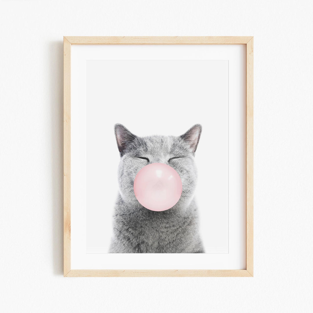 a picture of a cat with a bubble in its mouth