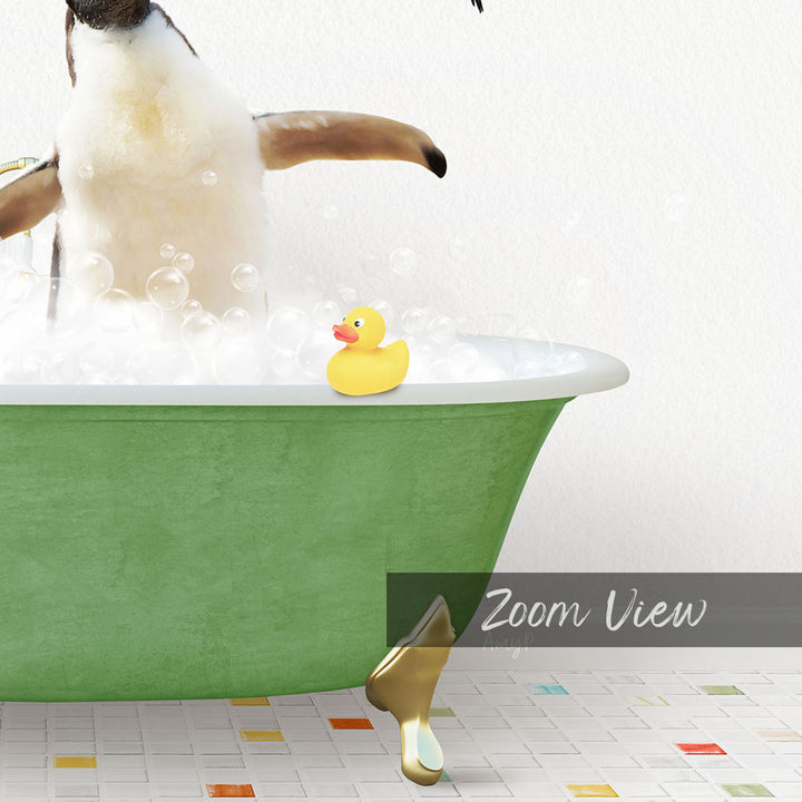 A penguin standing in a green bathtub filled with bubbles, with a yellow rubber duck floating on the water.