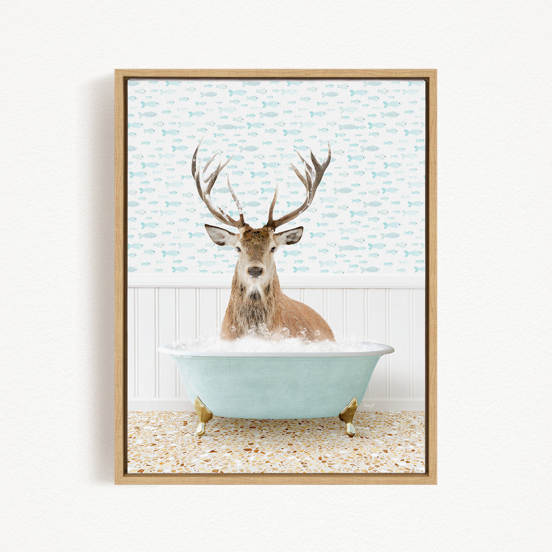 A deer with antlers is sitting in a bathtub filled with bubbles, surrounded by a pattern of fish on the wall behind it.