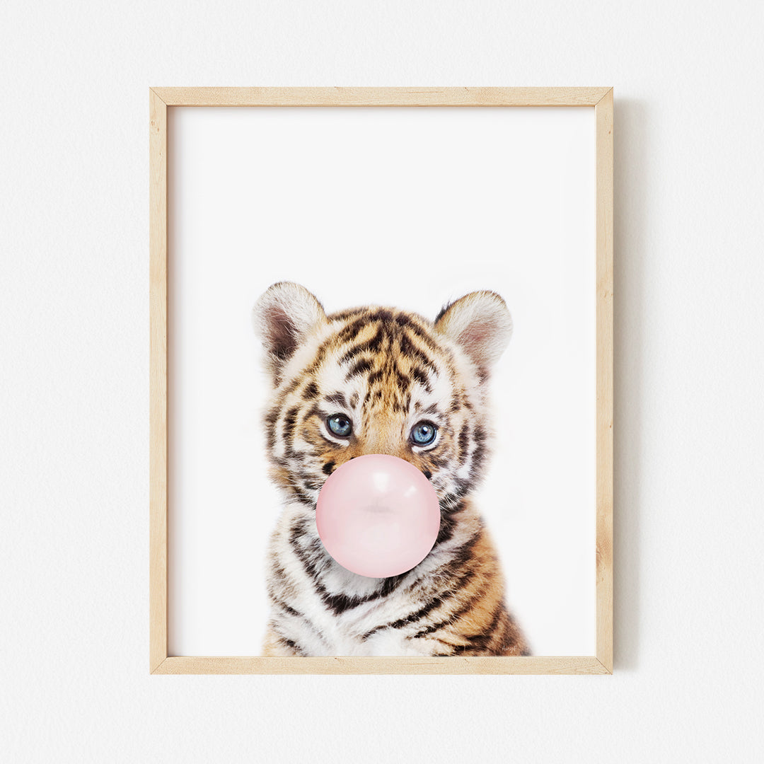 a picture of a baby tiger blowing a bubble