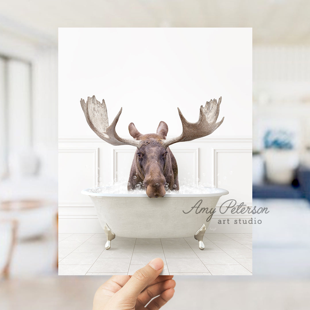 a person holding up a card with a picture of a moose in a bathtub