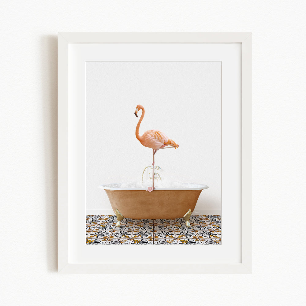 A framed image of a pink flamingo standing on a bathtub filled with water, with a patterned tile floor beneath.