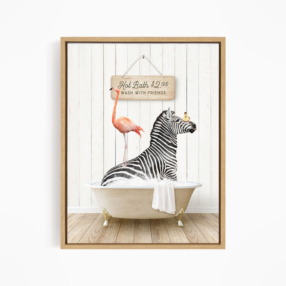 A framed image depicting a zebra sitting in a bathtub, with a pink flamingo standing on its back and a sign above the bathtub that reads "Hot Bath with Friends".