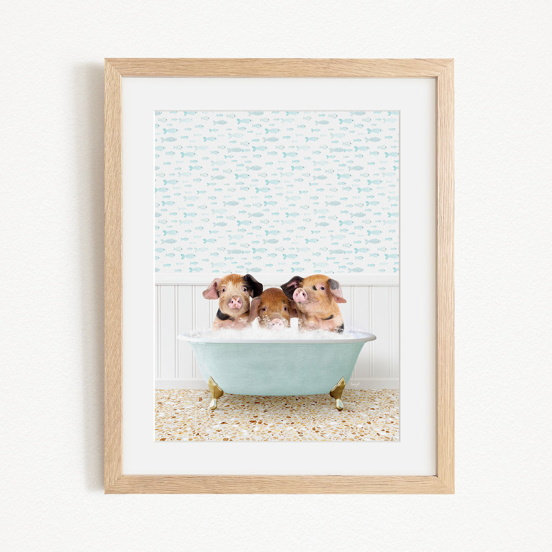Three adorable pigs sitting in a light blue bathtub, surrounded by a patterned wall and a tiled floor.