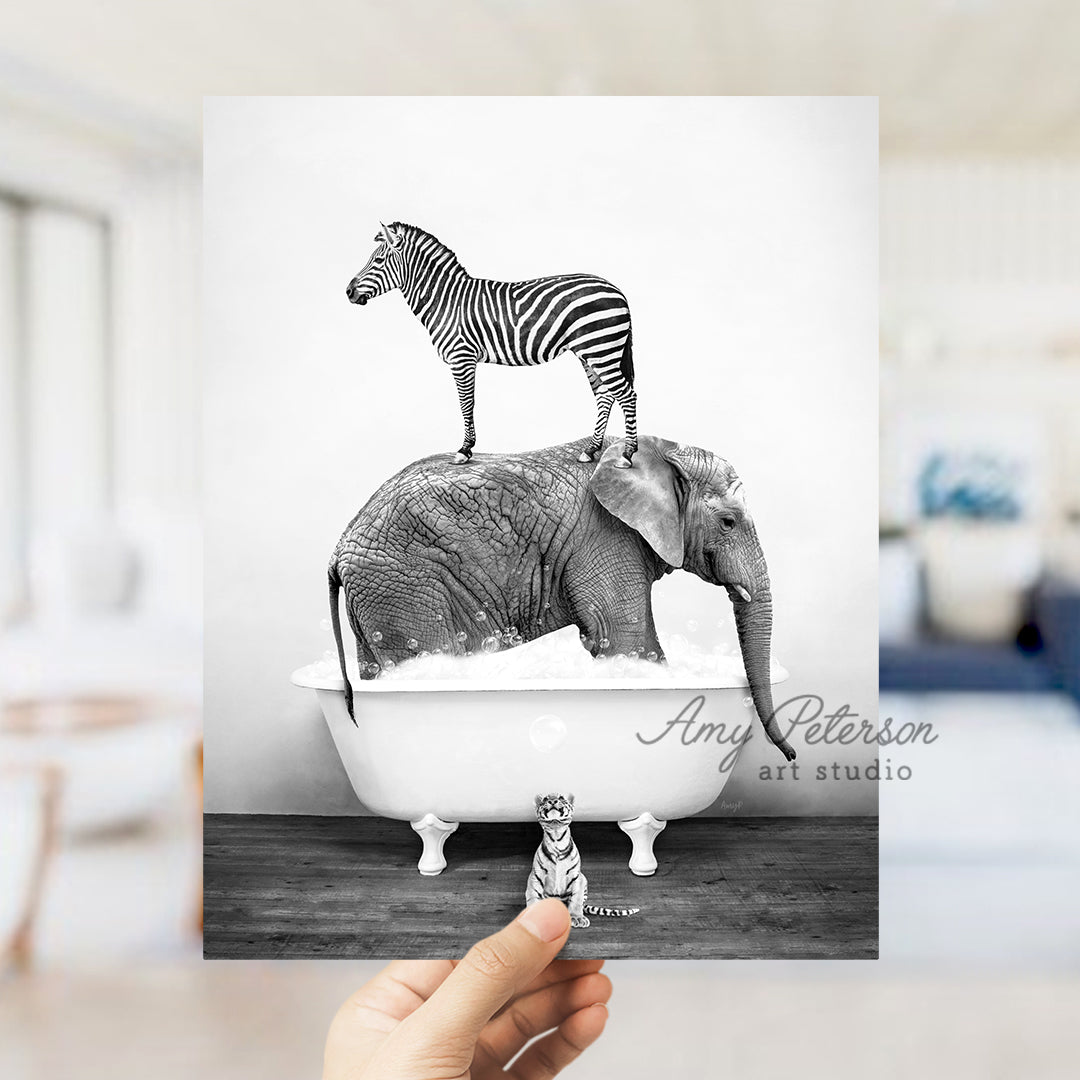 a person holding up a card with a zebra on top of an elephant in a