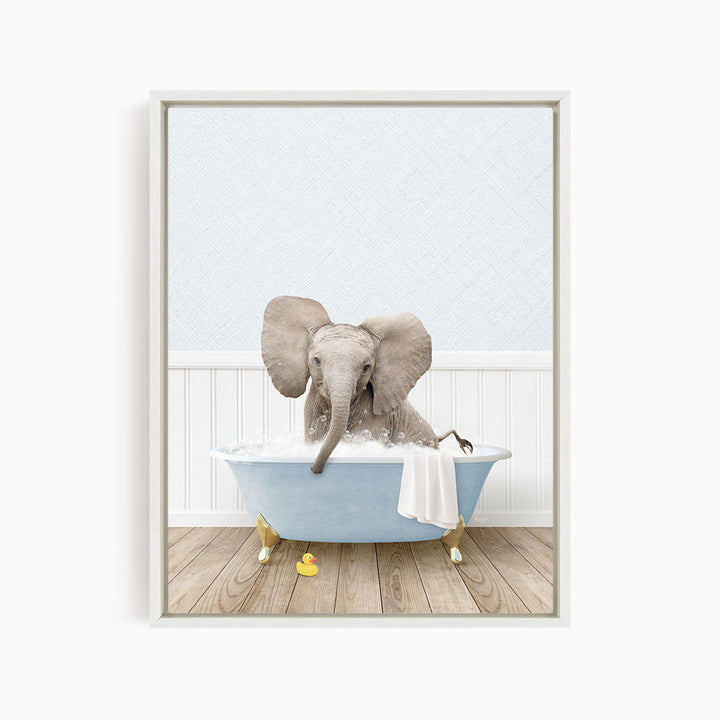 A baby elephant sitting in a blue bathtub filled with water, surrounded by rubber duckies.