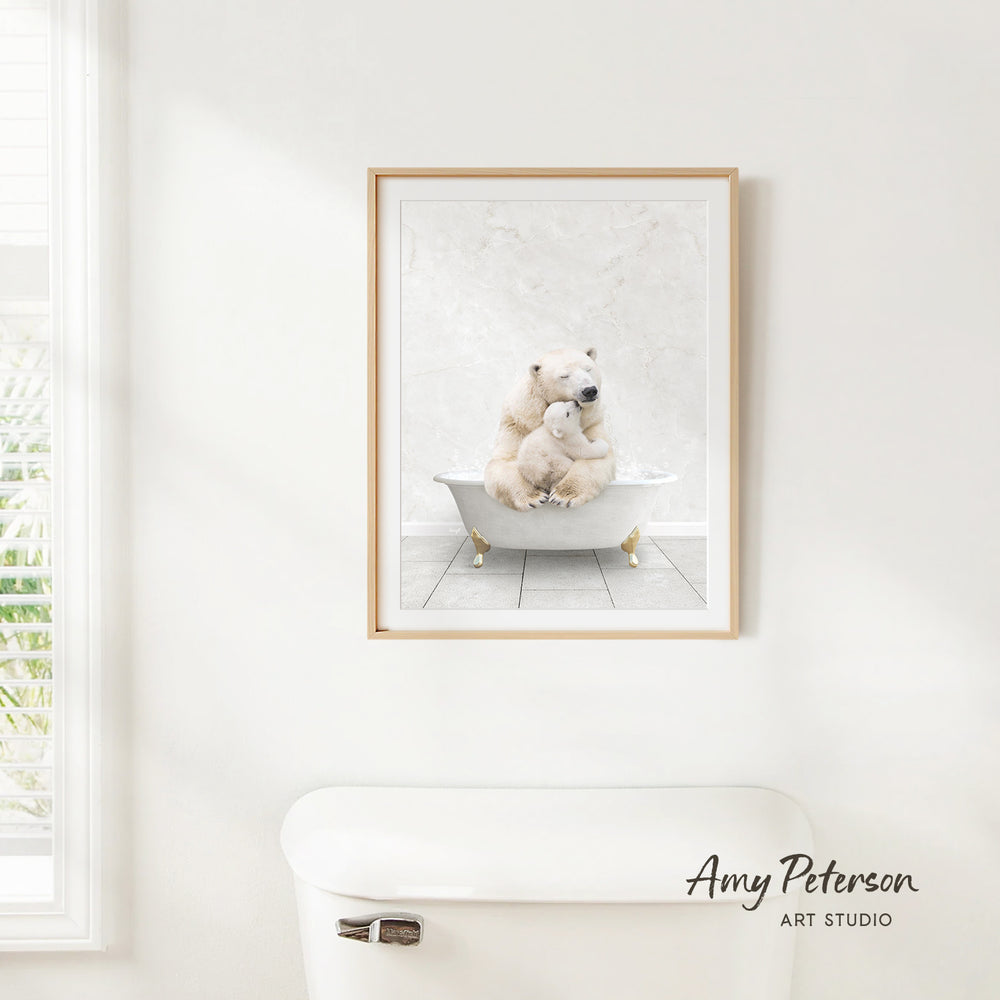 A framed image of a polar bear sitting in a bathtub, with a window and a toilet visible in the background.