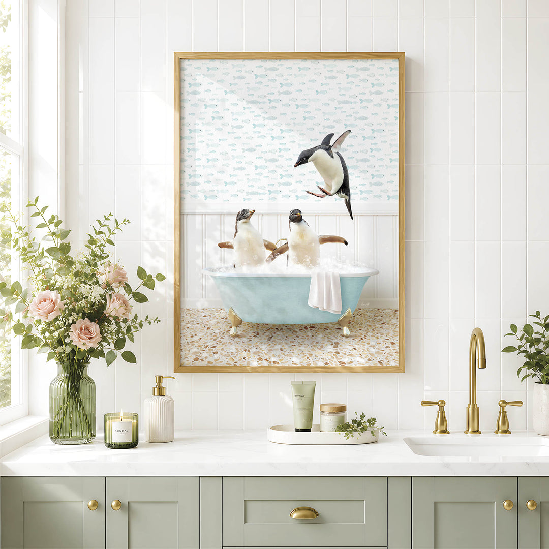 a bathroom scene with two penguins sitting in a bathtub, surrounded by a floral arrangement and a framed picture of penguins in the bathtub.