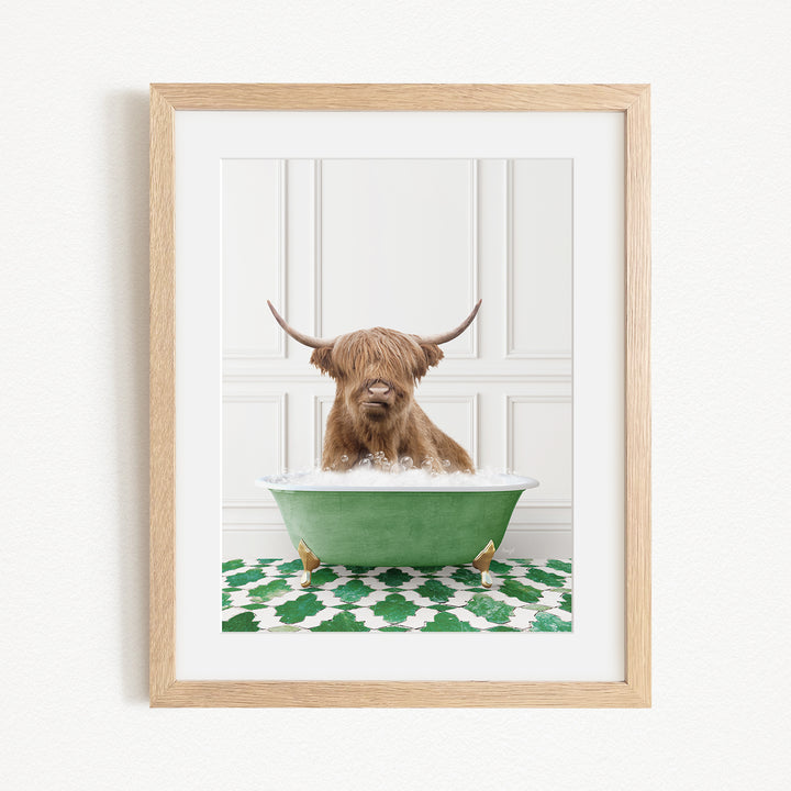 A brown cow with long horns is sitting in a green bathtub filled with water, creating a whimsical and playful scene.