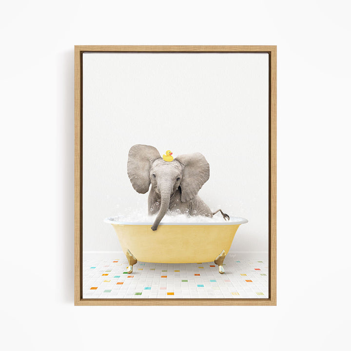 A gray elephant is sitting in a yellow bathtub filled with water, with a rubber duck floating on its head.