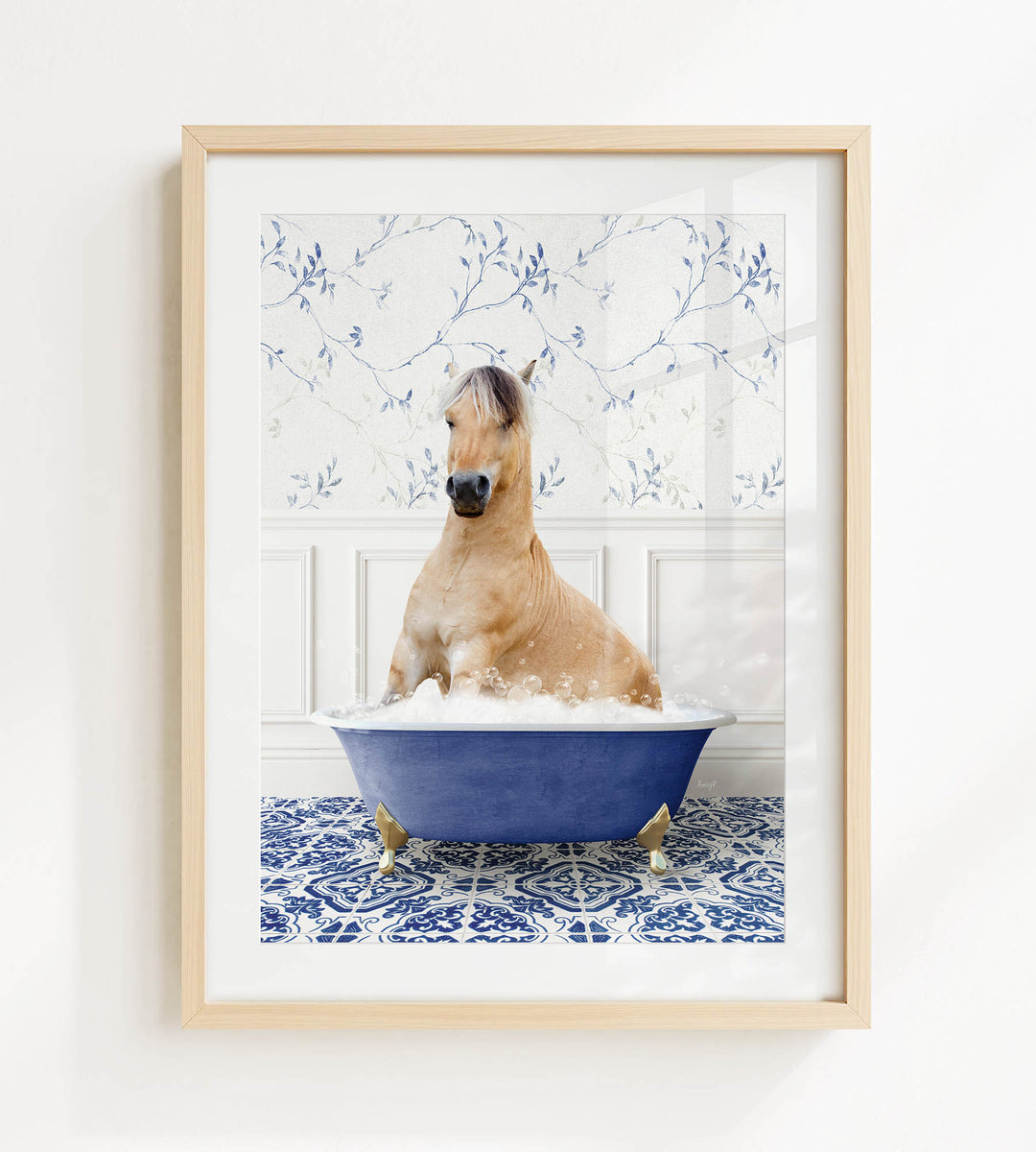 A light brown horse is sitting in a blue bathtub filled with water, surrounded by a blue and white patterned floor.