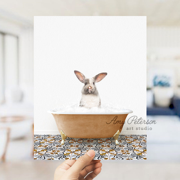 a person holding a card with a rabbit in a bathtub