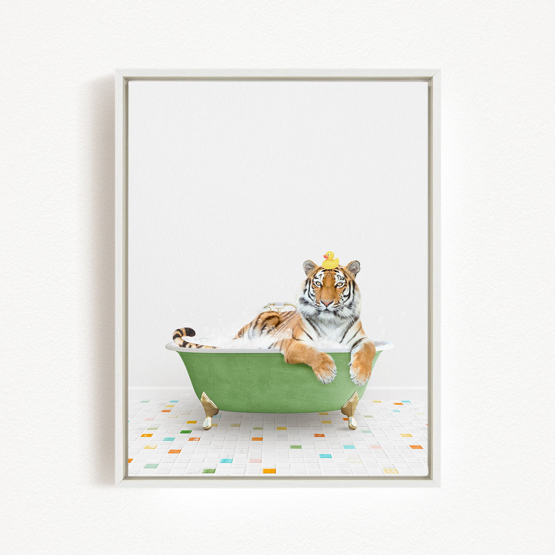 A tiger is sitting in a green bathtub, wearing a yellow crown and looking directly at the camera.