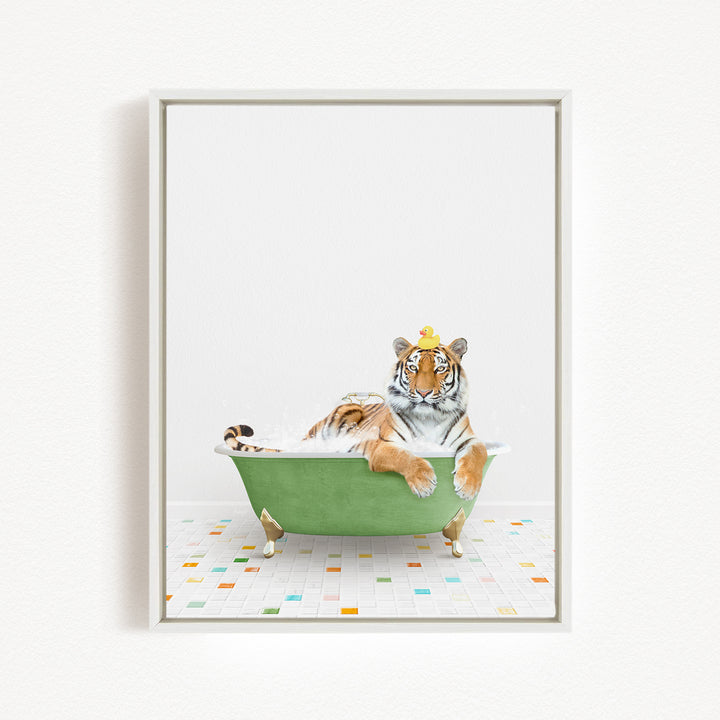 A tiger is sitting in a green bathtub, wearing a yellow crown and looking directly at the camera.