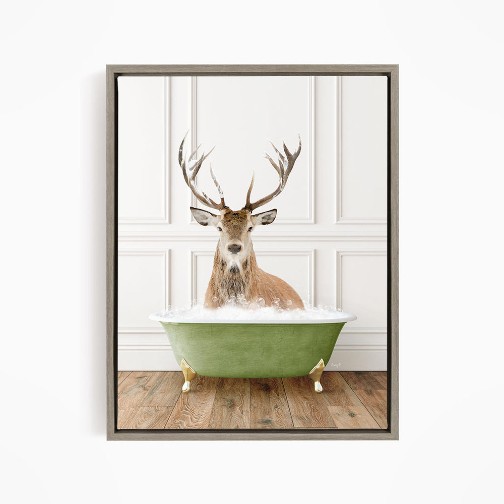 A deer with large antlers is sitting in a green bathtub filled with water, creating a whimsical and unexpected scene.