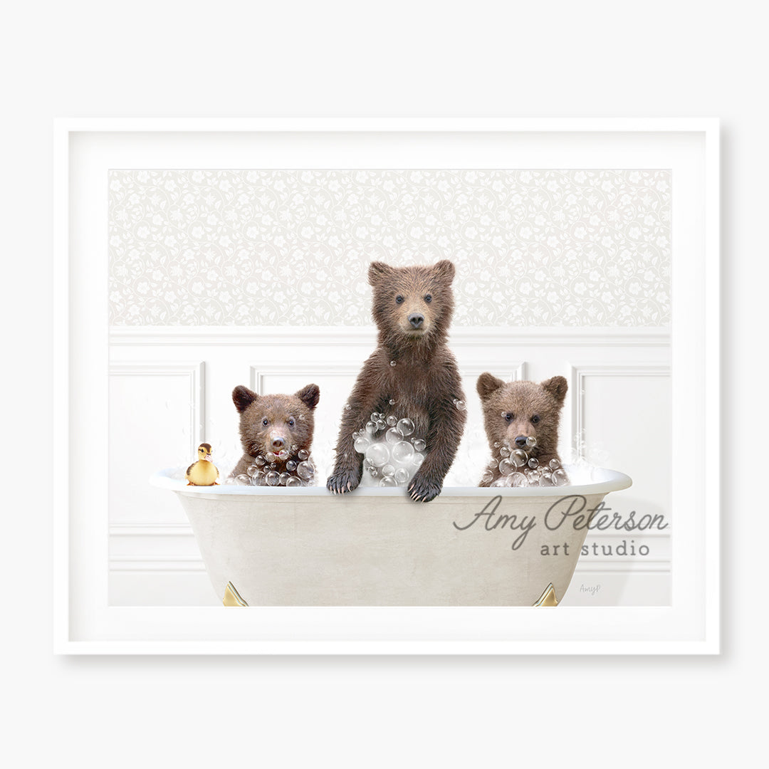 three brown bears are sitting in a bathtub