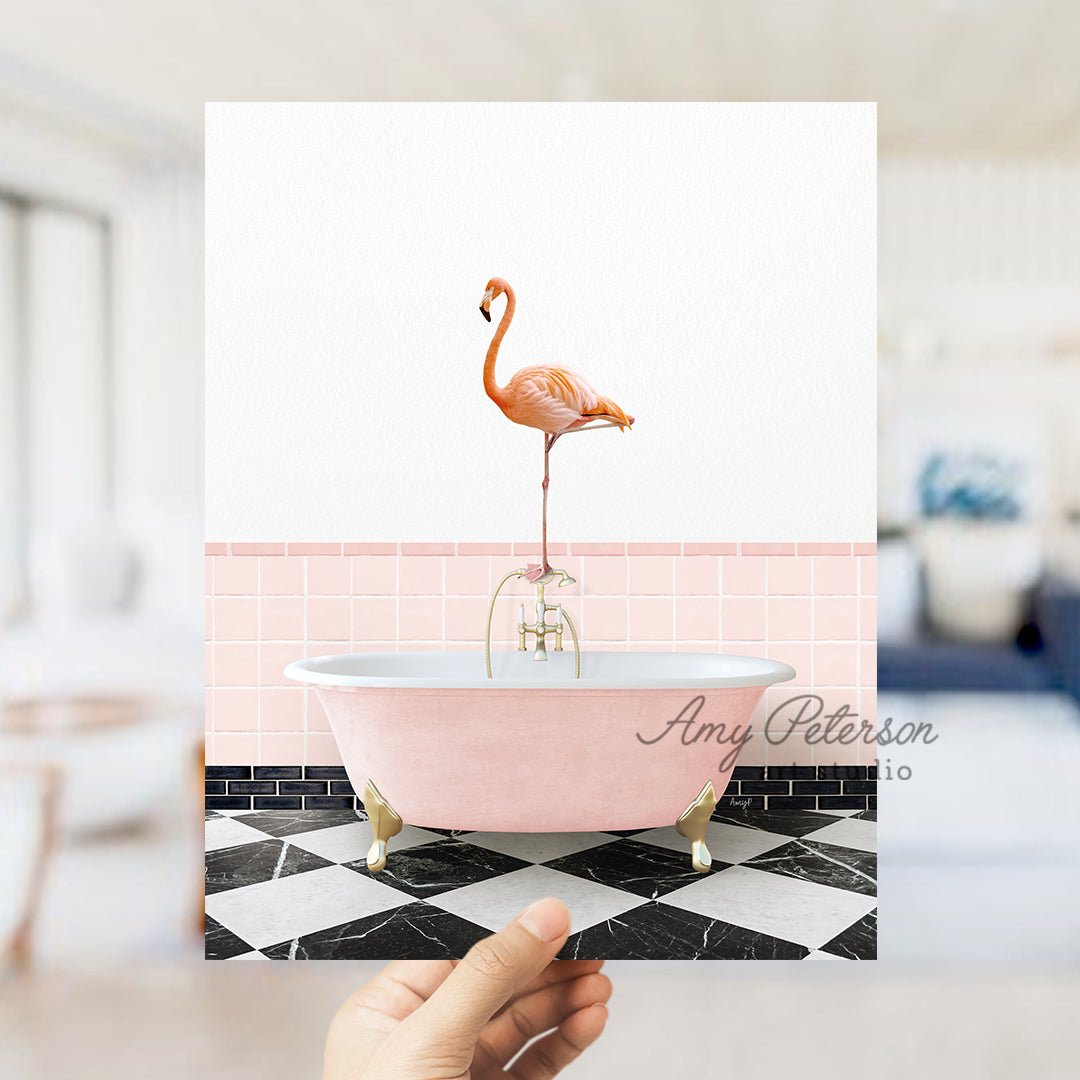 a pink bath tub with a pink flamingo on top of it