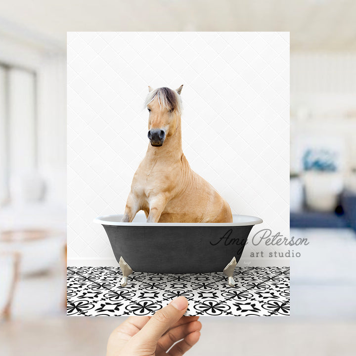 a person holding a card with a horse in a bathtub