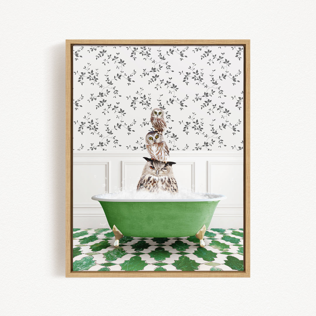A framed image depicting a cat sitting in a green bathtub filled with bubbles, surrounded by a patterned green and white floor.