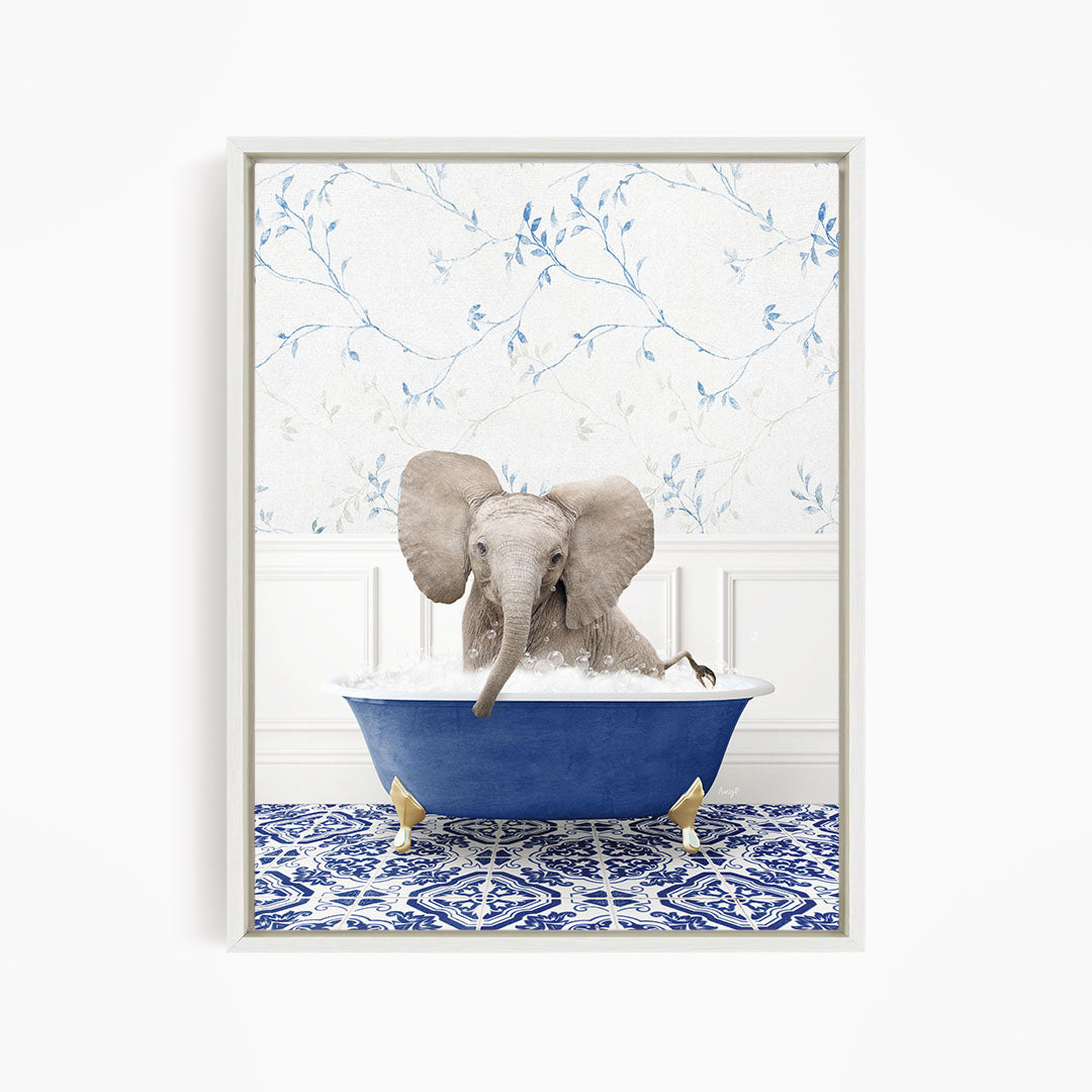 A gray elephant is sitting in a blue bathtub filled with water, surrounded by a blue and white patterned floor.