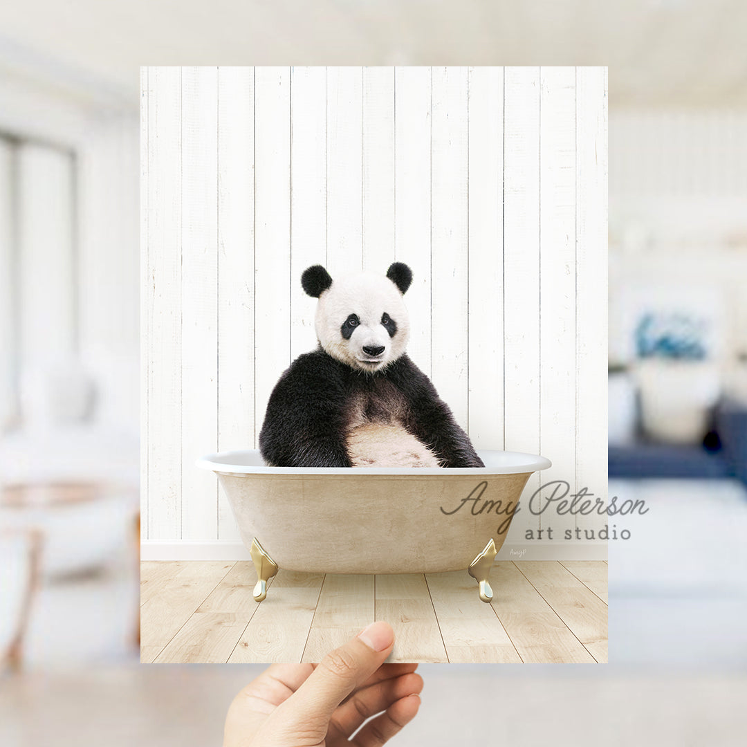 a panda bear sitting in a bath tub