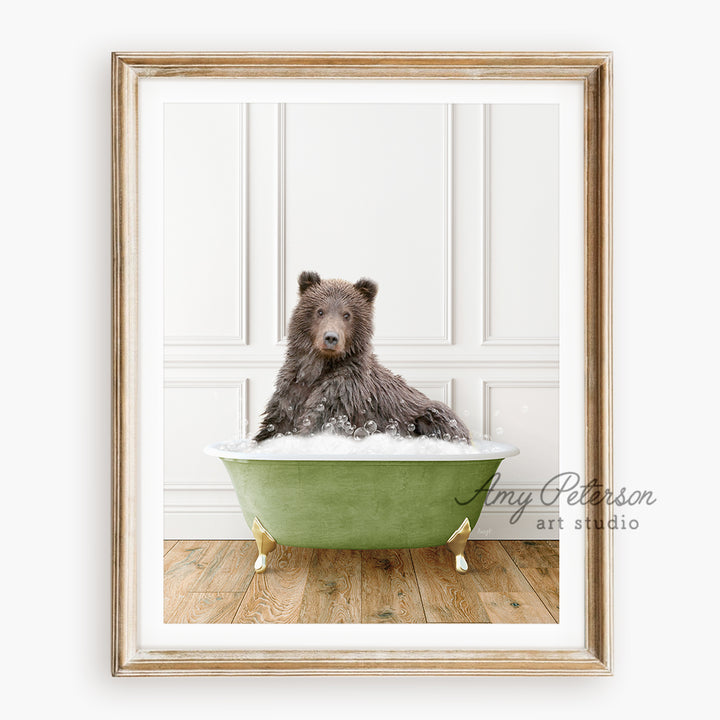 a brown bear sitting in a green bath tub