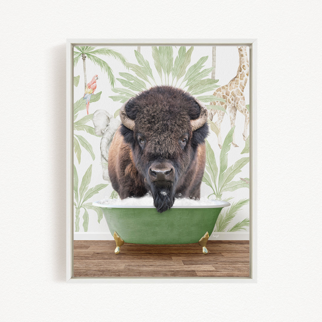 A buffalo with a long beard is sitting in a green bathtub, surrounded by tropical plants and a giraffe in the background.