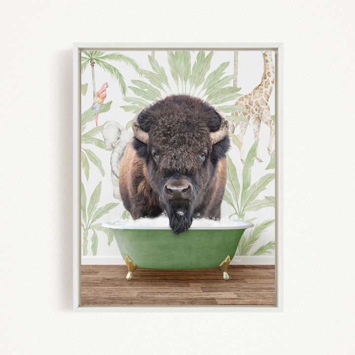 A buffalo with a long beard is sitting in a green bathtub, surrounded by tropical plants and a giraffe in the background.