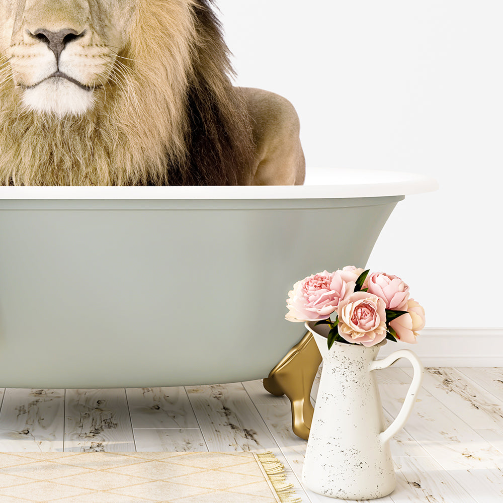 A large, majestic lion is sitting in a white bathtub, with a vase of pink flowers placed next to it on a wooden floor.