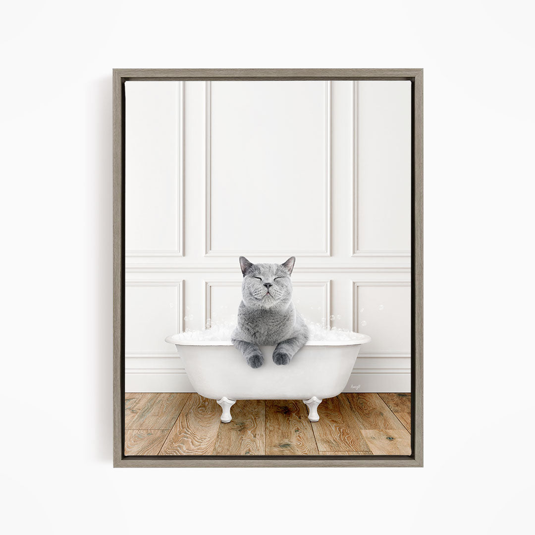 A gray cat sitting in a white bathtub, with its eyes closed and appearing to be enjoying the bath.