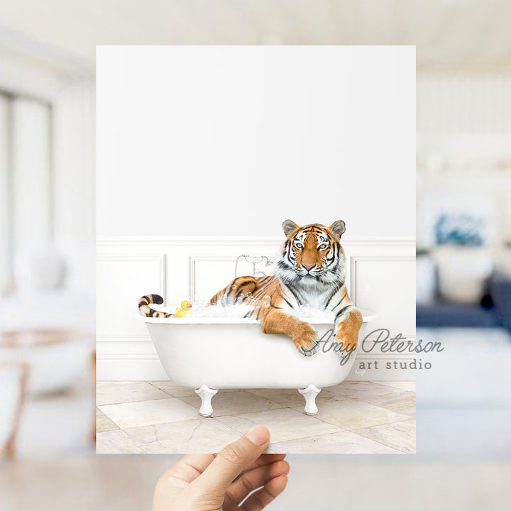 a hand holding up a card with a picture of a tiger in a bathtub