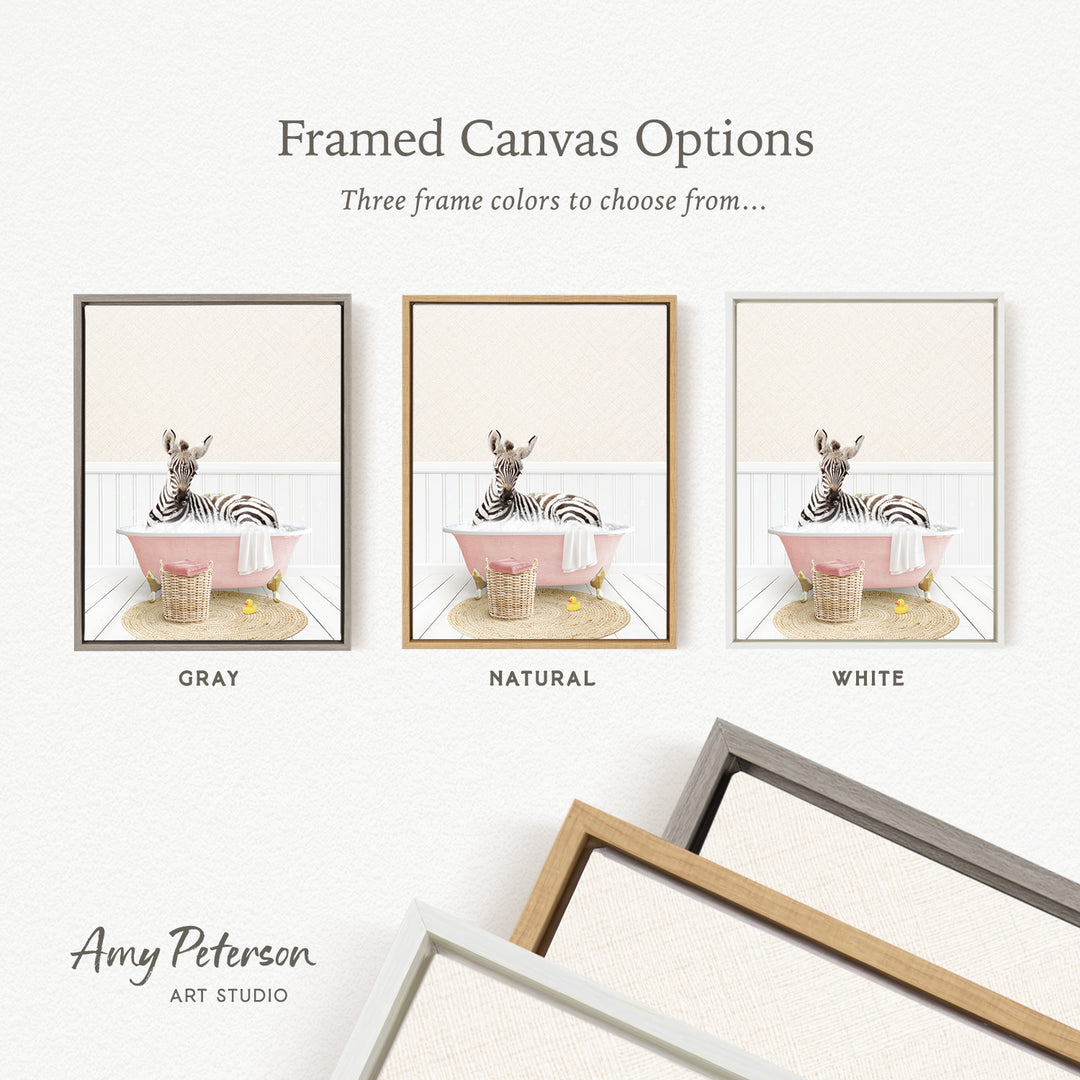 The image is a framed canvas option showcasing three different frame colors: gray, natural, and white. The canvas features a zebra sitting in a pink bathtub, and the frame color options are displayed below the canvas.