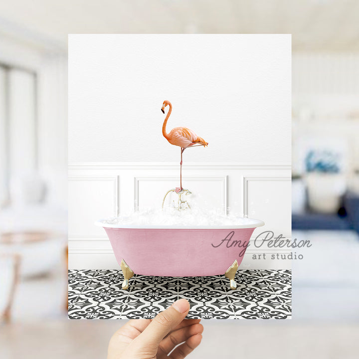 a pink bath tub with a pink flamingo on top of it