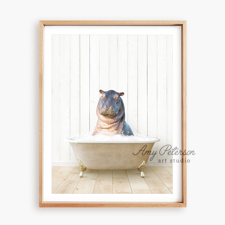 a hippopotamus sitting in a bathtub in front of a white wall