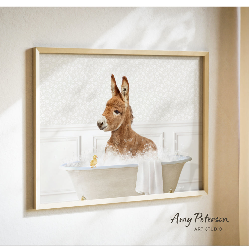 A donkey is sitting in a bathtub filled with bubbles, with a small yellow duck standing on the edge of the tub.
