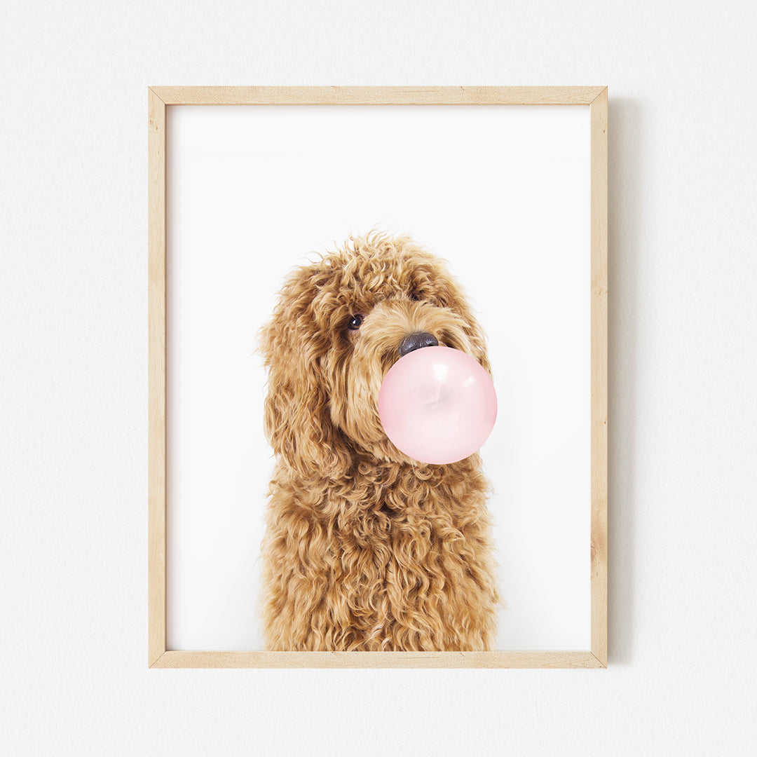 a dog with a bubble gum in its mouth