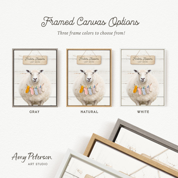 three framed canvas options featuring a sheep with a sign that reads "Finder's Lost Socks". The options include a gray frame, a natural frame, and a white frame.