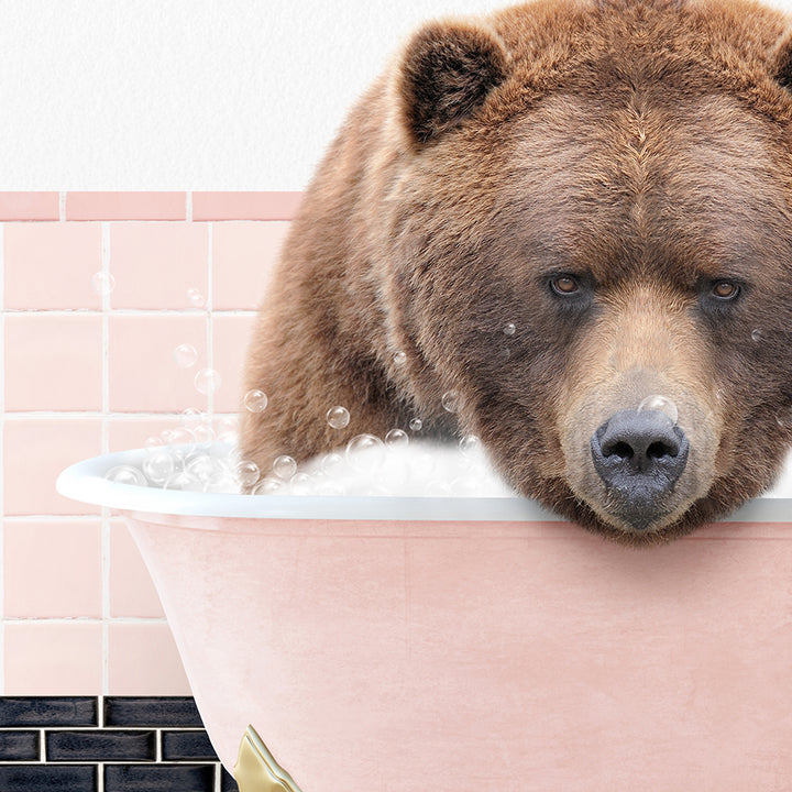 a brown bear taking a bath in a pink bathtub