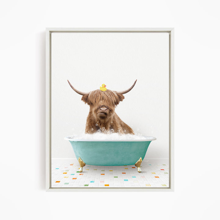A Highland cow with long horns is sitting in a blue bathtub filled with bubbles, with a yellow rubber duck perched on its head.