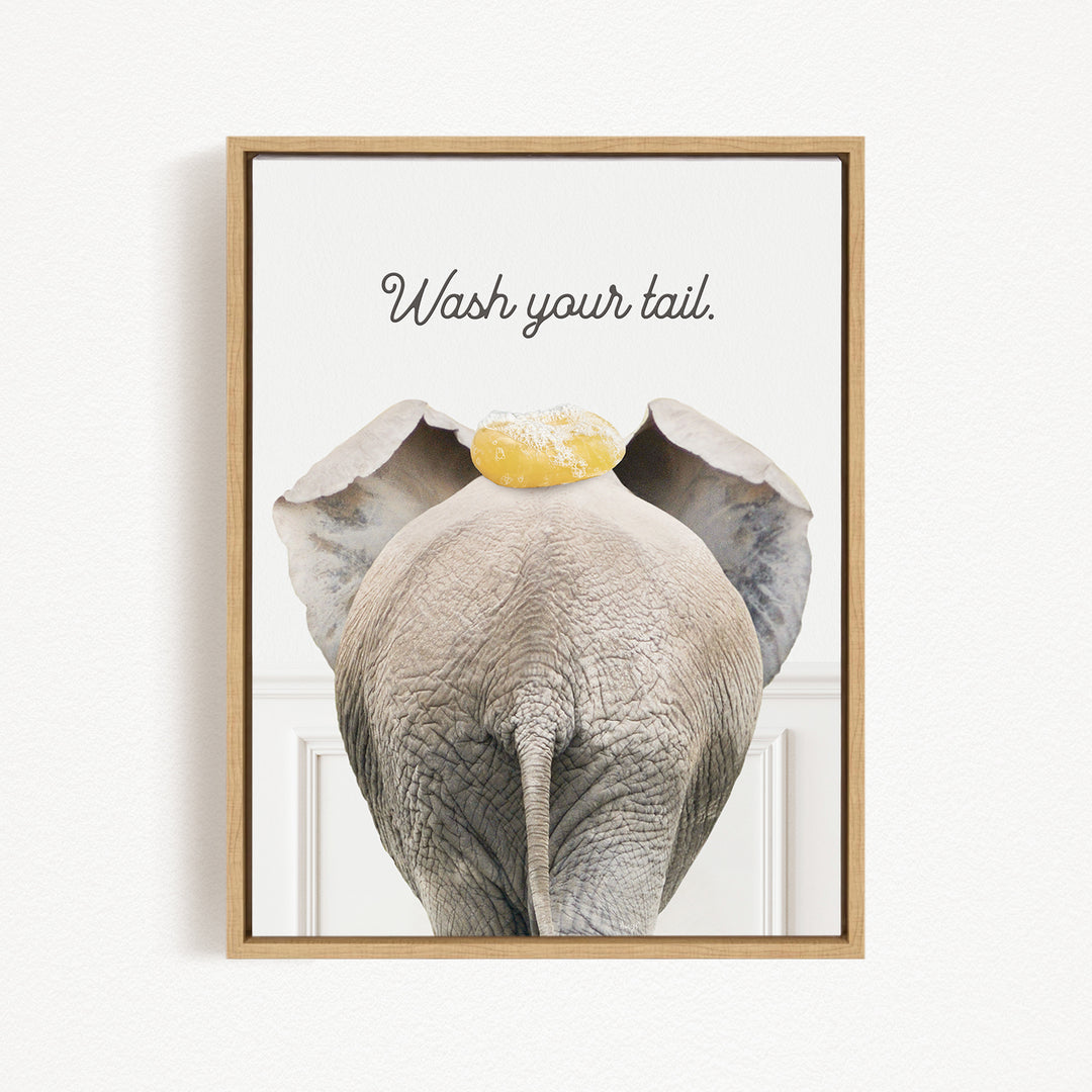 an elephant with a yellow object on its head, accompanied by the text "Wash your tail."
