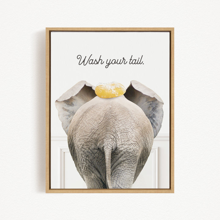 an elephant with a yellow object on its head, accompanied by the text "Wash your tail."