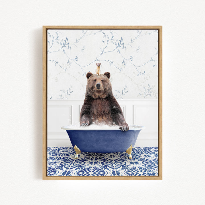 A brown bear sitting in a blue bathtub, surrounded by a floral patterned wall.