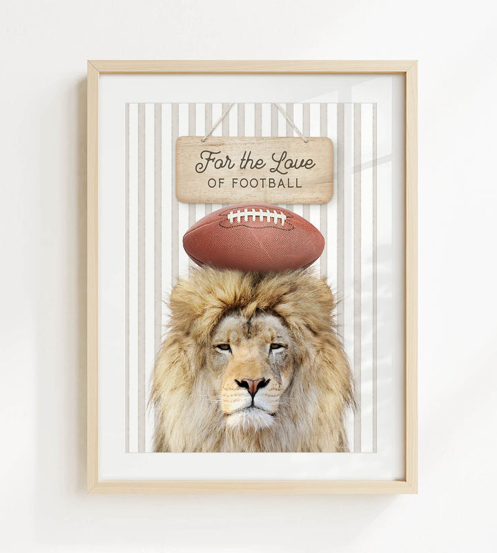 A framed image of a lion with a football on its head, accompanied by a wooden sign that reads "For the Love of Football".