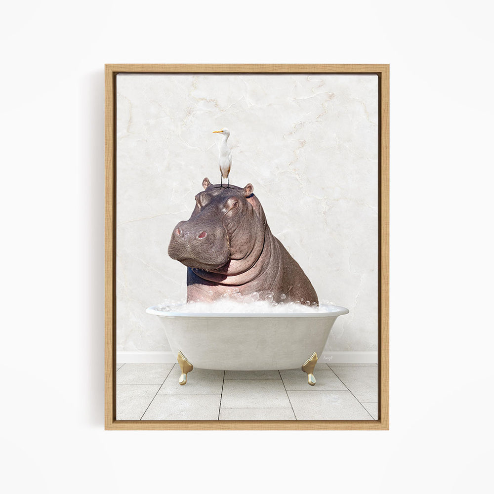 A framed image depicting a hippopotamus sitting in a bathtub, with a seagull perched on its head.
