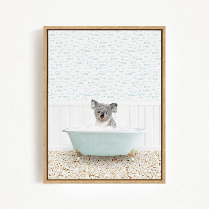 A koala bear sitting in a bathtub filled with bubbles, surrounded by a patterned wall and a tiled floor.